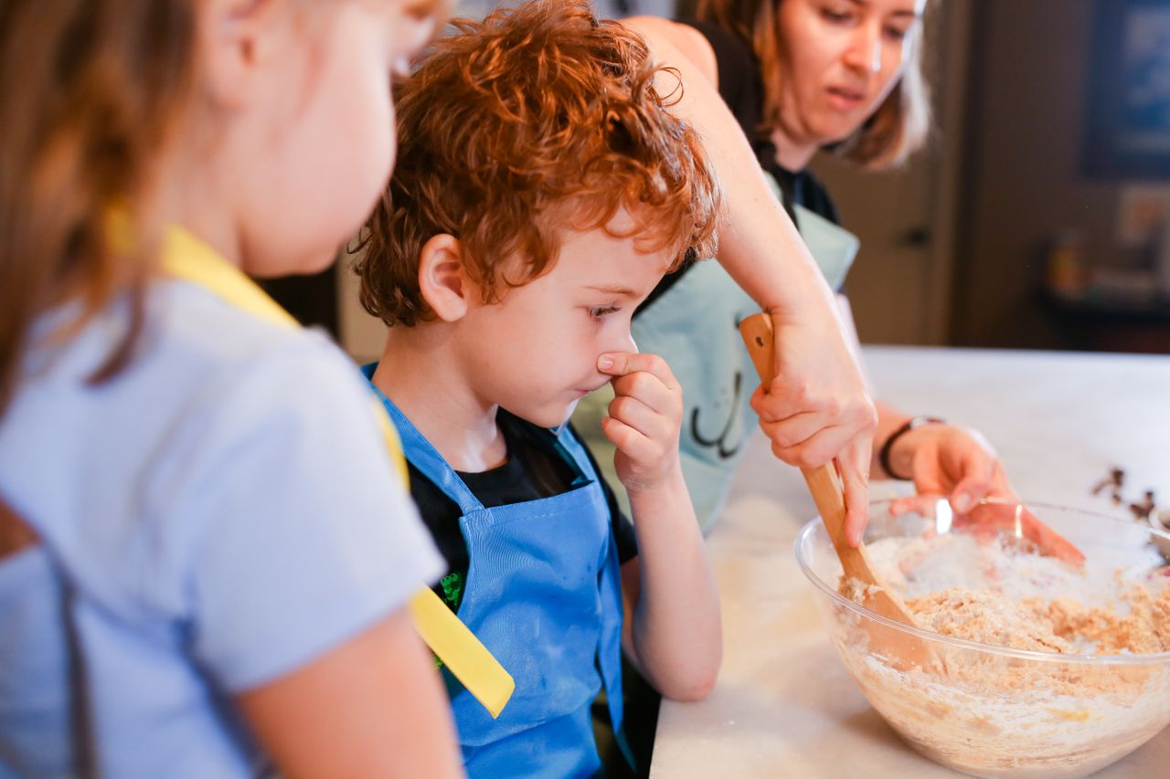 Home Children enjoy baking cookies with mom in a fun family cooking session.